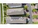 Aerial view of rooftops of homes, some with solar panels at 12064 Encore At Ovation Way, Winter Garden, FL 34787