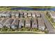 Birds-eye view of community with nearby pond and lake at 12064 Encore At Ovation Way, Winter Garden, FL 34787
