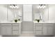 Bright bathroom with dual vanities, and white countertops at 12064 Encore At Ovation Way, Winter Garden, FL 34787