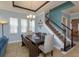 Dining area adjacent to the living room, perfect for Gathering meals and entertaining guests at 15672 Shorebird Ln, Winter Garden, FL 34787