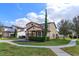 Charming two-story home with a well-manicured lawn and two-car garage at 15672 Shorebird Ln, Winter Garden, FL 34787
