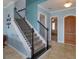 Inviting foyer with tile floors and a staircase leading to the second floor at 15672 Shorebird Ln, Winter Garden, FL 34787