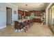 Eat-in kitchen features a large granite island, stainless steel appliances and dark wood cabinetry at 15672 Shorebird Ln, Winter Garden, FL 34787