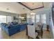 Spacious living room with tile floors, stylish decor, and ample natural light at 15672 Shorebird Ln, Winter Garden, FL 34787