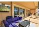 Inviting covered patio with comfortable seating area, tile flooring, and views of the pool at 15672 Shorebird Ln, Winter Garden, FL 34787