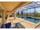 Stunning pool with screened-in lanai, outdoor kitchen, and waterfall feature for luxurious outdoor living at 15672 Shorebird Ln, Winter Garden, FL 34787