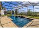 Well-maintained pool within a screened enclosure, providing privacy and protection from insects at 15672 Shorebird Ln, Winter Garden, FL 34787