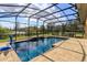 Private screened-in pool with lush landscaping offering a serene backyard oasis at 15672 Shorebird Ln, Winter Garden, FL 34787