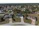 Aerial view of a home nestled in a well-established neighborhood, featuring tree-lined streets at 1597 Lansfield Ave, Deltona, FL 32738