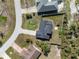 Aerial view of a house showing the backyard, driveway and surrounding neighborhood at 1597 Lansfield Ave, Deltona, FL 32738
