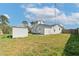 Spacious, fenced backyard featuring a storage shed and mature trees at 1597 Lansfield Ave, Deltona, FL 32738