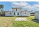 Expansive backyard featuring a well-maintained lawn, perfect for outdoor activities and relaxation at 1597 Lansfield Ave, Deltona, FL 32738