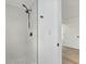 Stylish bathroom with a glass shower stall, sleek fixtures, and modern design at 1597 Lansfield Ave, Deltona, FL 32738