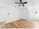 Bright bedroom with wood-look floors and white walls at 1597 Lansfield Ave, Deltona, FL 32738