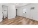 This bright bedroom features wood-look flooring, with attached bath and walk-in closet at 1597 Lansfield Ave, Deltona, FL 32738