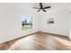 Inviting bedroom with large windows and wood floors at 1597 Lansfield Ave, Deltona, FL 32738