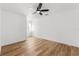 Bright bedroom with ceiling fan and light colored wood-look flooring at 1597 Lansfield Ave, Deltona, FL 32738