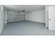 Spacious two-car garage with freshly painted floor and walls at 1597 Lansfield Ave, Deltona, FL 32738