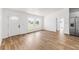 Bright living room with wood floors and view to the front yard at 1597 Lansfield Ave, Deltona, FL 32738