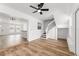 Spacious living room with laminate floors and ceiling fan at 1597 Lansfield Ave, Deltona, FL 32738