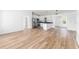 Spacious living room featuring hardwood floors and an open floor plan into the kitchen at 1597 Lansfield Ave, Deltona, FL 32738