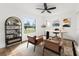 Bright home office with lots of natural light, modern decor, and wood laminate flooring at 1597 Lansfield Ave, Deltona, FL 32738