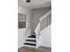 Black and white staircase with view of window at 1597 Lansfield Ave, Deltona, FL 32738