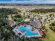 Aerial view of resort style community amenities including clubhouse, pool, playground, and more at 1598 Barberry Dr, Kissimmee, FL 34744
