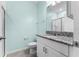 Modern bathroom featuring vanity with granite countertops and walk-in shower at 1598 Barberry Dr, Kissimmee, FL 34744
