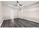 Bedroom with ceiling fan, walk-in closet, vinyl plank flooring, and neutral walls at 1598 Barberry Dr, Kissimmee, FL 34744