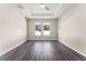 Large bedroom features vinyl plank flooring, ceiling fan, and two windows at 1598 Barberry Dr, Kissimmee, FL 34744