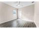Cozy bedroom with laminate floors, a window, and a closet at 1598 Barberry Dr, Kissimmee, FL 34744