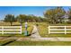 Fenced dog park with grass and walking path at 1598 Barberry Dr, Kissimmee, FL 34744