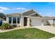 Charming one-story home with a well-manicured lawn, complemented by a two car garage and beautiful landscaping at 1598 Barberry Dr, Kissimmee, FL 34744