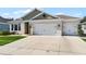 Beautiful home exterior featuring a driveway leading to a spacious two-car garage at 1598 Barberry Dr, Kissimmee, FL 34744