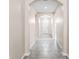 Inviting hallway with arched entryways and tiled flooring at 1598 Barberry Dr, Kissimmee, FL 34744