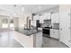 Kitchen with a spacious island, modern appliances, and stylish pendant lighting at 1598 Barberry Dr, Kissimmee, FL 34744