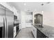 Open kitchen design with stainless steel appliances and a large island at 1598 Barberry Dr, Kissimmee, FL 34744