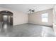 Spacious living room featuring neutral walls, tile floors, and a ceiling fan at 1598 Barberry Dr, Kissimmee, FL 34744