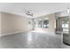 Bright and airy living room featuring modern tile flooring and three large windows at 1598 Barberry Dr, Kissimmee, FL 34744