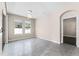 Bright living room with two large windows and stylish light fixture at 1598 Barberry Dr, Kissimmee, FL 34744