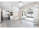 Open-concept living room with tile floors and access to the kitchen at 1598 Barberry Dr, Kissimmee, FL 34744