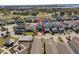 Birds-eye view of a well-maintained home with a patio, lawn, and driveway, surrounded by other similar homes at 1763 Standing Rock Cir, Oakland, FL 34787