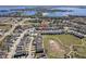 A high aerial view showcasing the house's location within a community, with a view of a large lake in the distance at 1763 Standing Rock Cir, Oakland, FL 34787