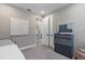 Cozy bedroom with gray walls, gray carpet, dresser with mirror, and white accents at 1763 Standing Rock Cir, Oakland, FL 34787