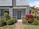 Charming home featuring a brick pathway, stone accents, manicured landscaping and modern front door at 1763 Standing Rock Cir, Oakland, FL 34787