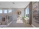 Bright upstairs hallway with views, artwork, and natural light at 1763 Standing Rock Cir, Oakland, FL 34787