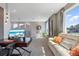 Bright living room features plush seating, work space, and large windows for plenty of natural light at 1763 Standing Rock Cir, Oakland, FL 34787