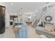 Open-concept living space features a kitchen with an island, dining area, and comfortable seating at 1763 Standing Rock Cir, Oakland, FL 34787