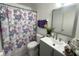Cozy bathroom features a floral shower curtain and gray vanity with a square sink at 1866 Caralee Blvd # 3, Orlando, FL 32822